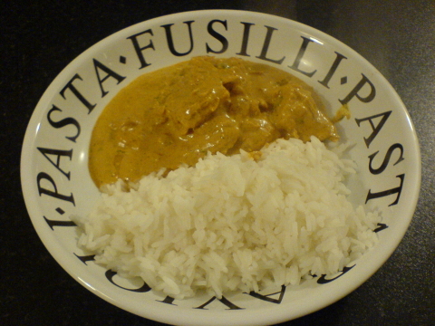 Butter Chicken served in a bowl alongside rice