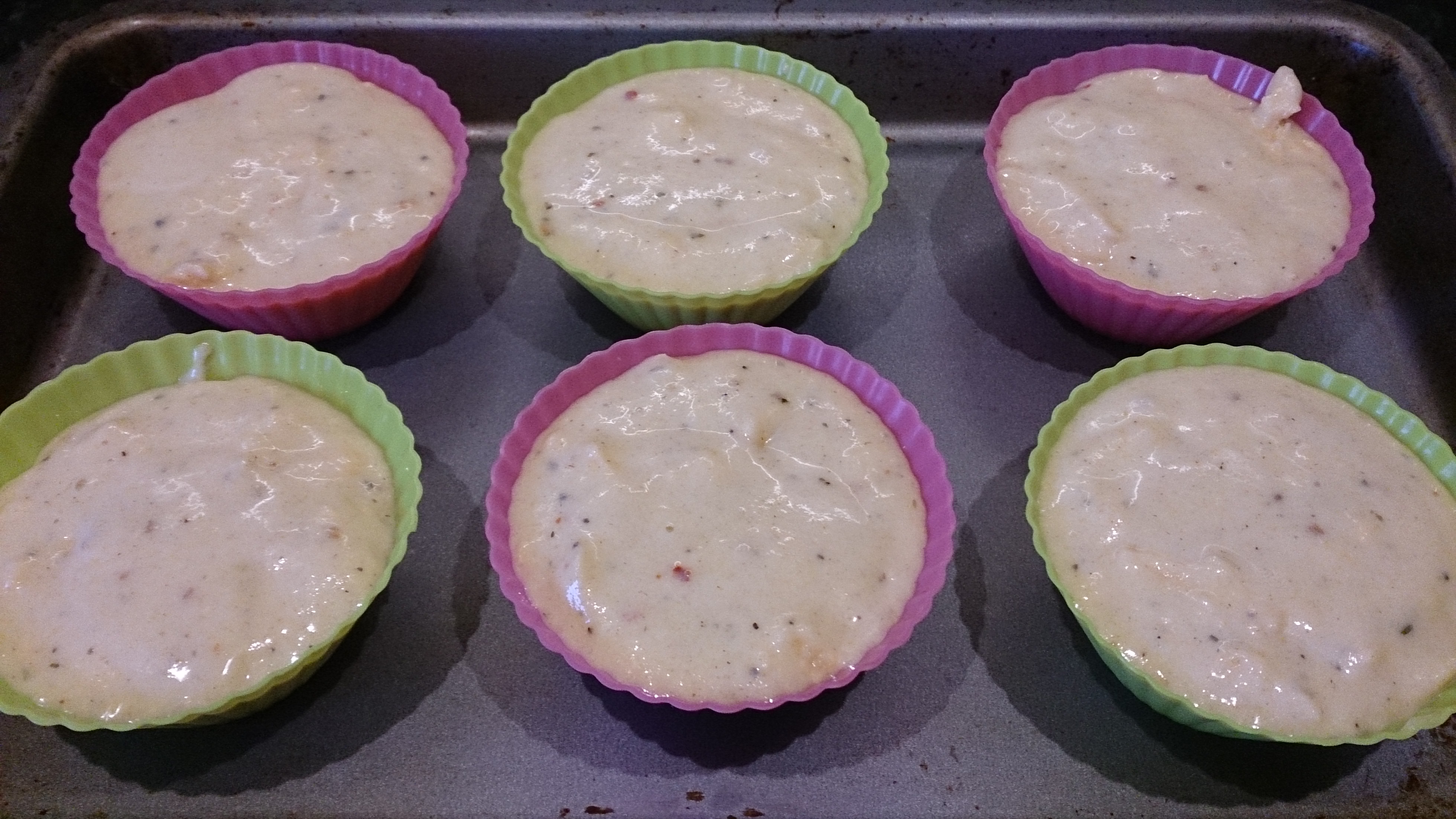 Cornbread muffin dough in individual silicone muffin cups