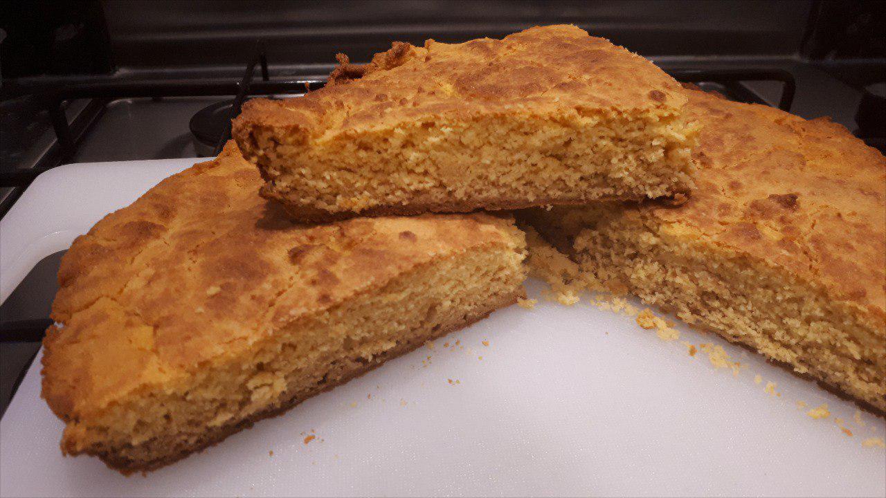 Cast iron cornbread slices on a white cuttibng board