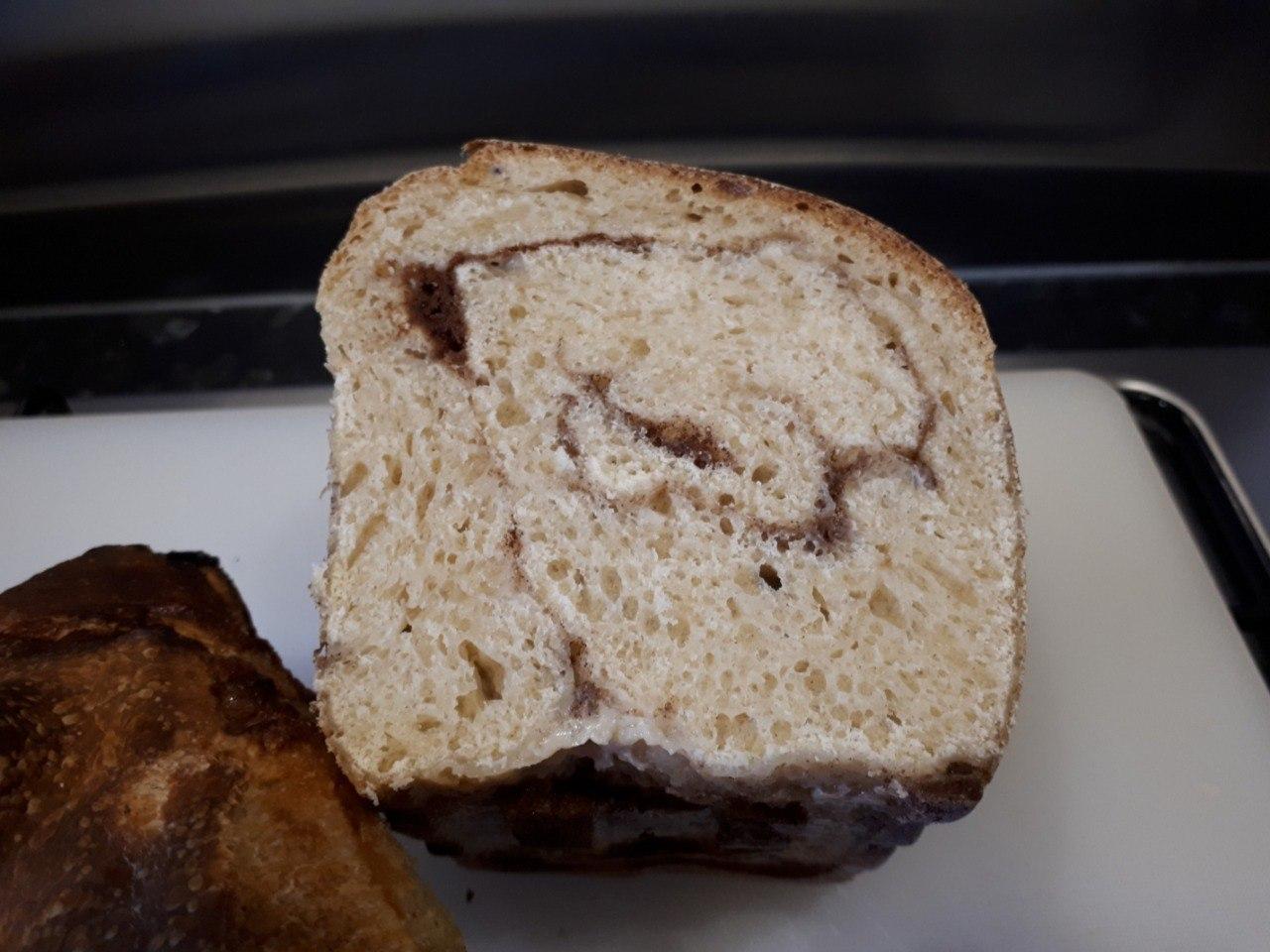 Cinnamon Raisin Sourdough Bread sliced to show the cinnamon swirl inside