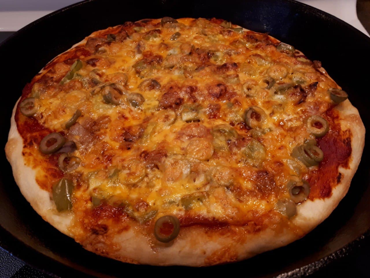 Sourdough Pizza in a cast iron frying pan