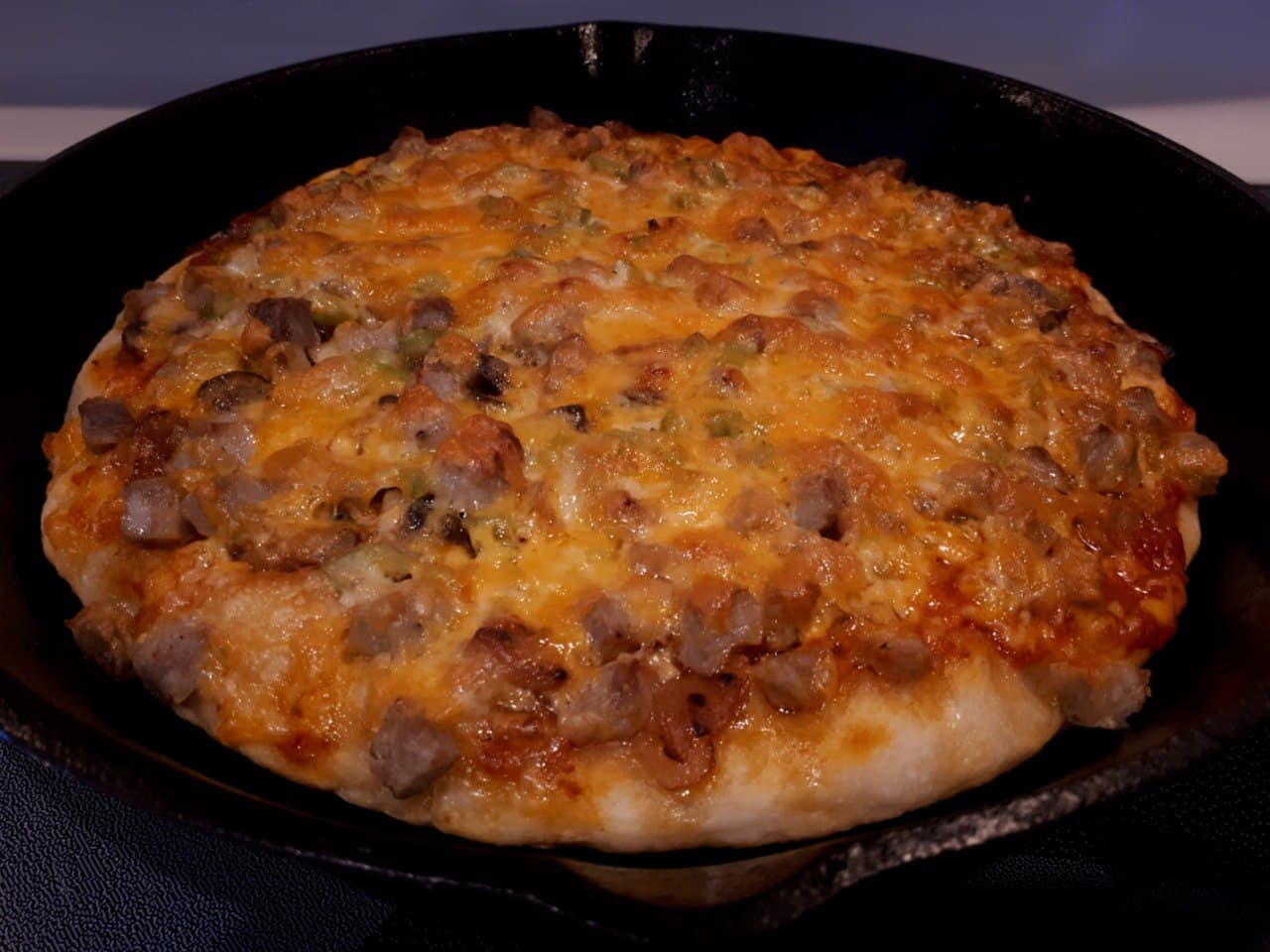 Sourdough Pizza in a cast iron frying pa